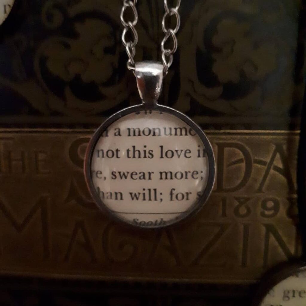 a necklace made from a book page